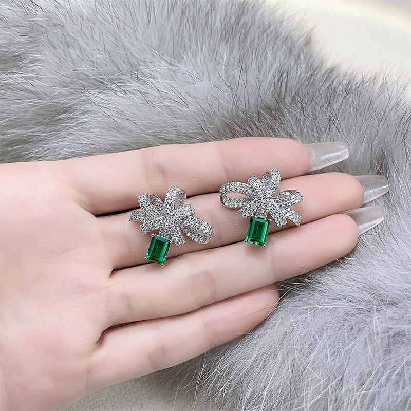 silver bow earrings with simulated emerald, view 5 - MRSLM