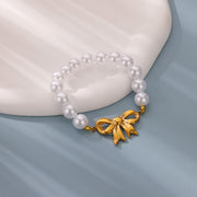 gold bowknot bracelet with imitation pearls, view 4 - MRSLM