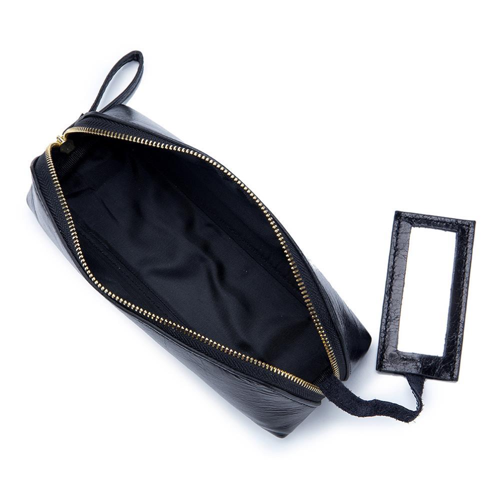 Portable female hand holding cosmetic bag - MRSLM