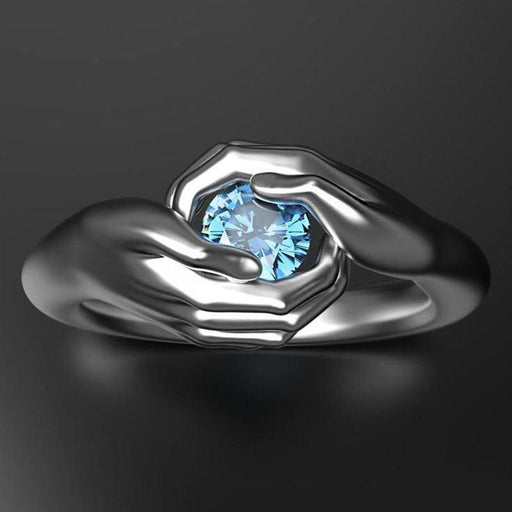 Blue crystal zircon hands embrace ring - MRSLM